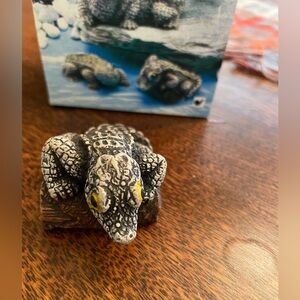 Alligator sitting on a log Figurine